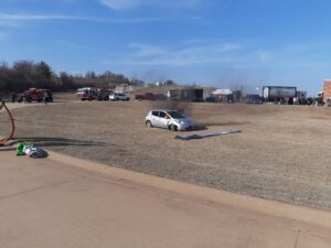 US fire chiefs watch the demonstration of the Fire Cloak EV fire blanket